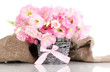 bouquet of eustoma flowers in  wicker vase, isolated on white