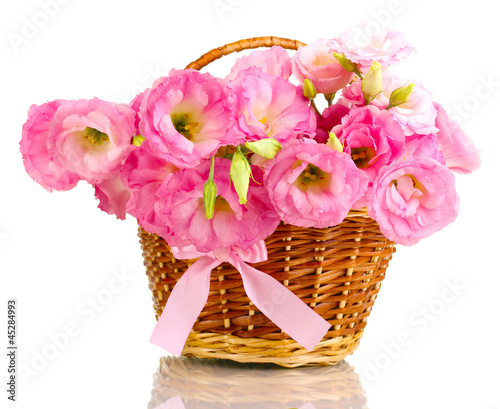Photo: bouquet of eustoma flowers in basket, isolated on white bouquet of eustoma flowers in basket, isolated on white