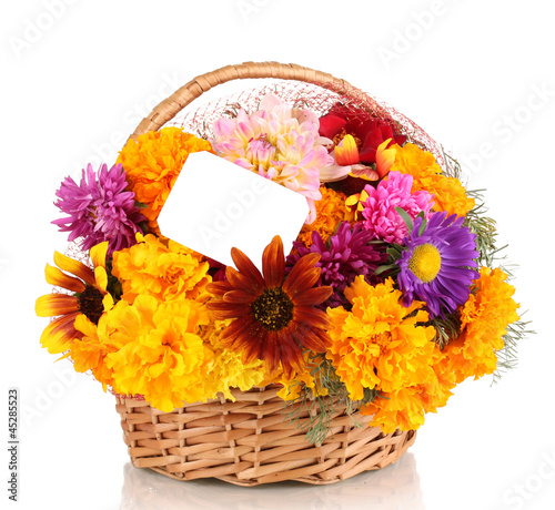 Photo: Beautiful bouquet of bright flowers in basket with paper note Beautiful bouquet of bright flowers in basket with paper note