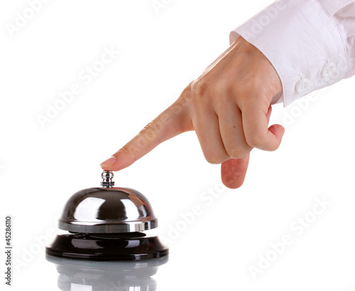 Photo: Hand ringing in service bell isolated on white Hand ringing in service bell isolated on white
