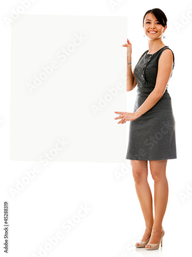 Photo: Business woman holding a banner Business woman holding a banner