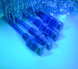 network cables and hub closeup with fiber optical background