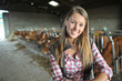 Portrait of woman working in barn