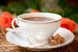 cup of tea and brown sugar and roses