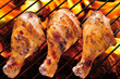 Grilled chicken legs on the grill.