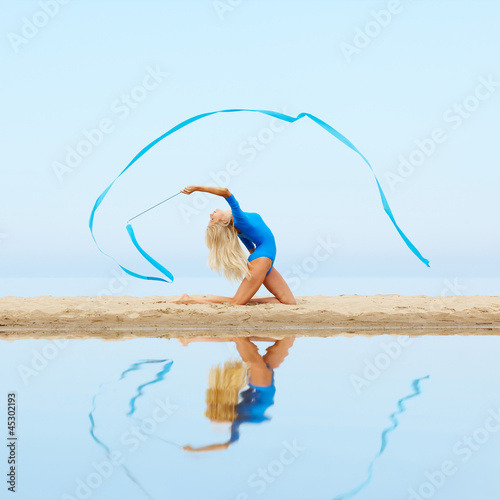 Photo: girl training on beach girl training on beach