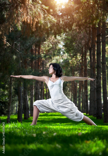 Photo: Yoga warrior pose in park Yoga warrior pose in park