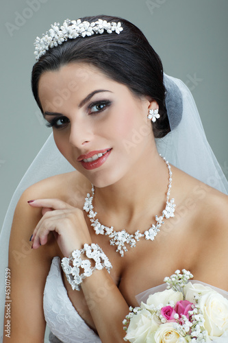 Photo: Portrait of beautiful bride. Wedding dress. Wedding decoration Portrait of beautiful bride. Wedding dress. Wedding decoration