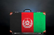 The Afghan flag on a suitcase for travel.