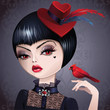 portrait of sophisticated  woman in hat holding bird