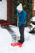 Woman with snow shovel