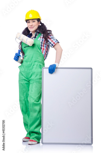 Photo: Woman builder with blank board Woman builder with blank board