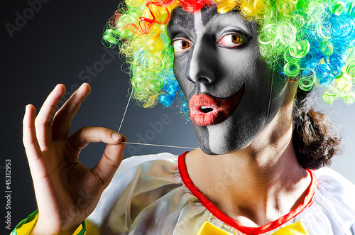 Photo: Funny clown in studio shooting Funny clown in studio shooting