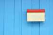 Grunge postbox on blue wood wall