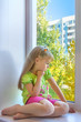 Sad girl in the window