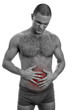 Front view of muscular man suffering from stomach pain.