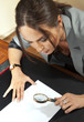woman looks on document