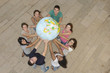 Photo: Multiracial group holding the Earth Globe showing Africa Multiracial group holding the Earth Globe showing Africa