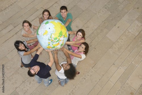 Photo: Group holding the Earth Globe showing Europe Group holding the Earth Globe showing Europe