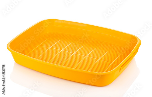 Photo: Yellow plastic litter cat isolated on white Yellow plastic litter cat isolated on white