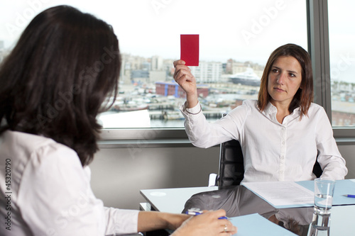 Photo: Woman being dismissed Woman being dismissed