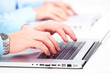 Hands with a computer keyboard.