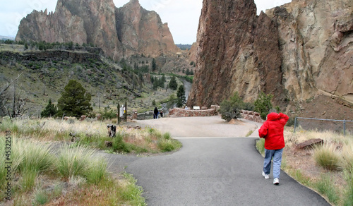 Photo: Woman in red parka, hiking Woman in red parka, hiking
