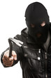 Photo: Criminal thief or burglar man in balaclava or mask holding crowb Criminal thief or burglar man in balaclava or mask holding crowb