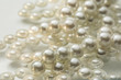Shining string of white pearl in water