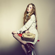 Portrait of a beautiful young woman with a handbag