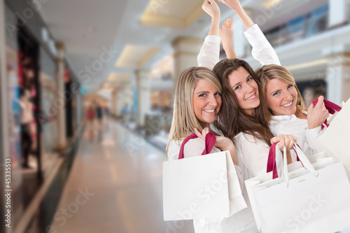 Photo: Three happy shoppers Three happy shoppers