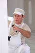 Man painting a wall