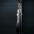 Young beauty behind the door