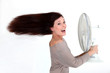 Brunette stood in front of fan