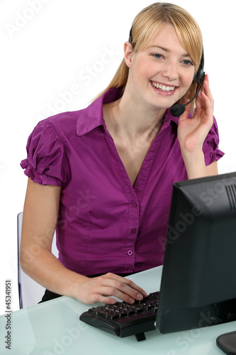 Photo: Woman with a headset laughing Woman with a headset laughing