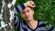 Beautiful young man posing in the park.