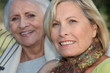 Two elderly ladies sat in the garden together