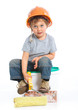 Boy in hard hat with brick