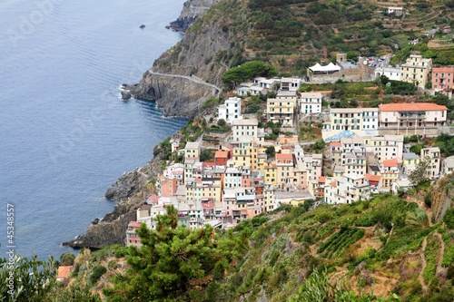 Photo: Riomaggiore, cliff and town Riomaggiore, cliff and town