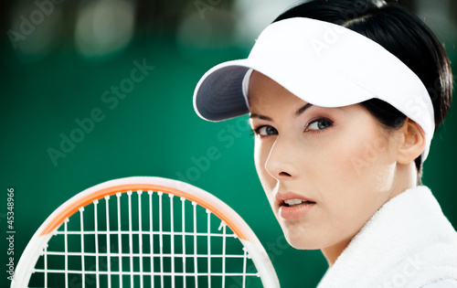 Photo: Close up of successful female tennis player Close up of successful female tennis player