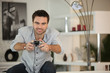 Competitive man playing video games