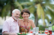 Older couple eating outdoors