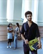 Indian college student smiling in the campus.