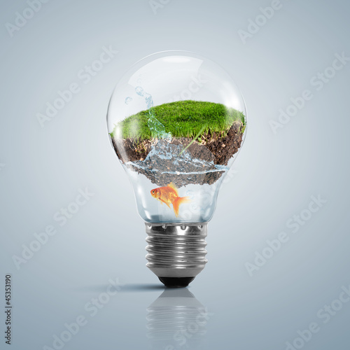 Photo: Lamp bulb with clean nature symbol inside Lamp bulb with clean nature symbol inside
