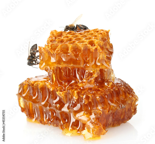 Photo: sweet honeycomb with honey and bee, isolated on white sweet honeycomb with honey and bee, isolated on white