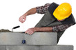 Mason building a bricks wall