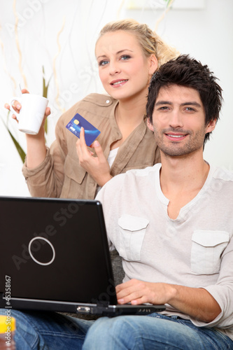 Photo: young couple shopping online young couple shopping online