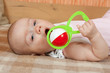 Baby with rattle