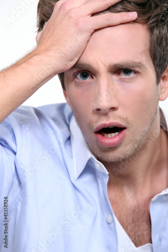 Photo: young man in moment of panic young man in moment of panic