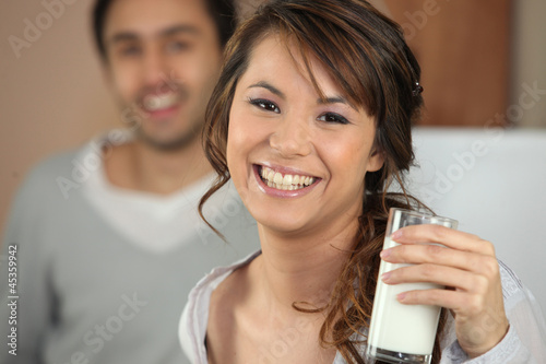 Photo: Young woman with a glass of milk Young woman with a glass of milk